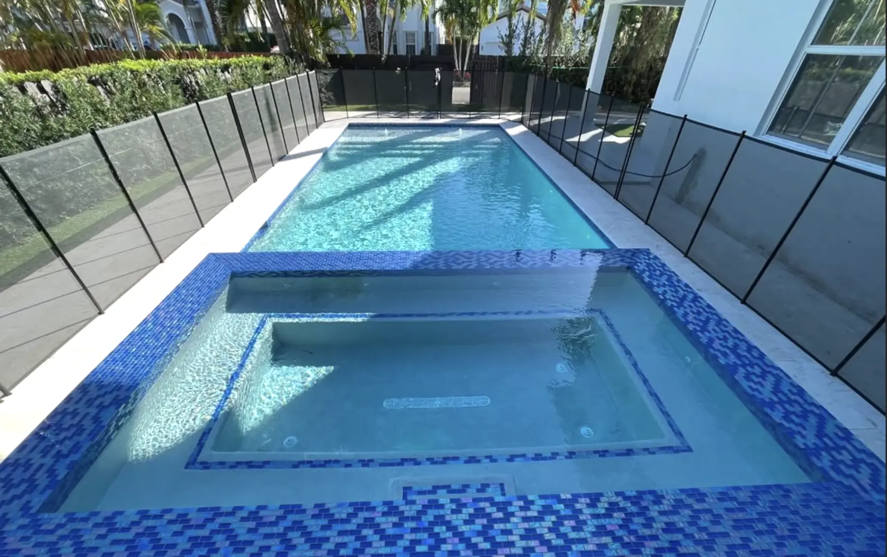 Pool and spa renovation with blue tile